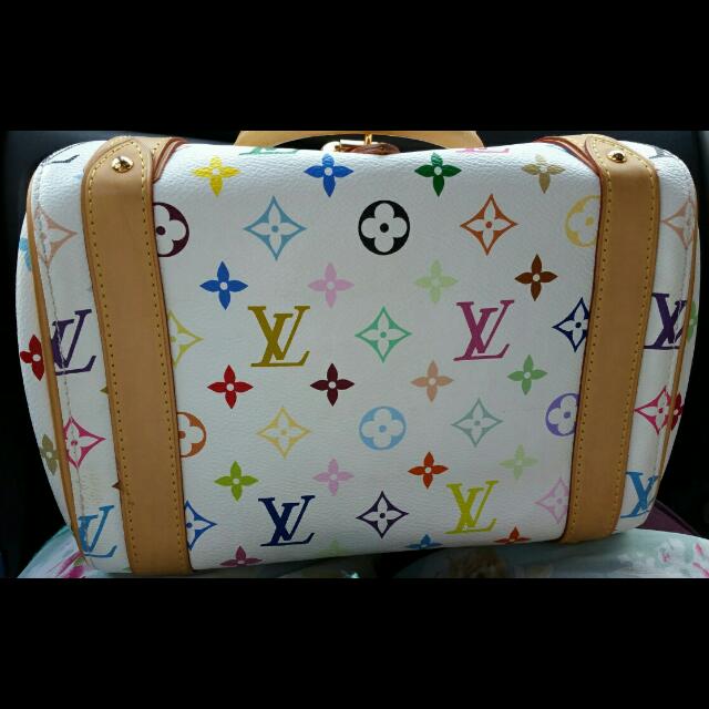 Authentic Louis Vuitton LV Murakami Priscilla Multicolore Bag (Category: Purses & Pouches) located in Singapore. Submitted by joyfleur (Listing ID 66994755, Image 3). Description: Authentic Louis Vuitton Priscilla bag 10.5" L x 7.5" W x 8.25" H In good condition Comes with LV dustbag and carrier Nett price Price is firm. Questions about reducing the price and trade-ins will not be answered. Key clochet is not included as this bag originally doesn