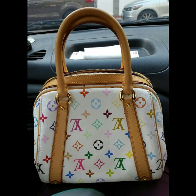 Authentic Louis Vuitton LV Murakami Priscilla Multicolore Bag (Category: Purses & Pouches) located in Singapore. Submitted by joyfleur (Listing ID 66994755, Image 2). Description: Authentic Louis Vuitton Priscilla bag 10.5" L x 7.5" W x 8.25" H In good condition Comes with LV dustbag and carrier Nett price Price is firm. Questions about reducing the price and trade-ins will not be answered. Key clochet is not included as this bag originally doesn