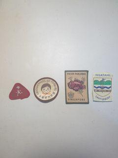 Scouts Badges. Left red triangular one only.