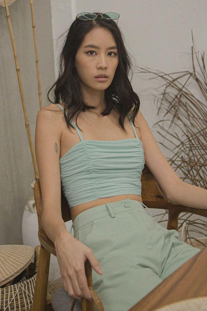 YHF darling ruched top in honeydew green (Category: Sleeveless) located in Singapore. Submitted by bonboncookies (Listing ID 1170464072, Image 1). Description: Size L Honeydew green colour.