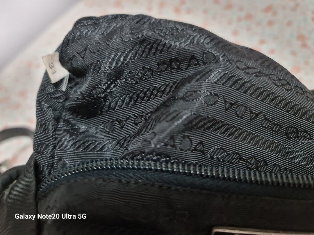 Heavily used Vintage Prada backpack (Category: Bags & Wallets) located in Singapore. Submitted by szane1 (Listing ID 1264918285, Image 8). Description: Authentic Vintage Prada Backpack, comes with bag alone. Take note the condition of this vintage piece- pics reflected as best as I could to show true condition..