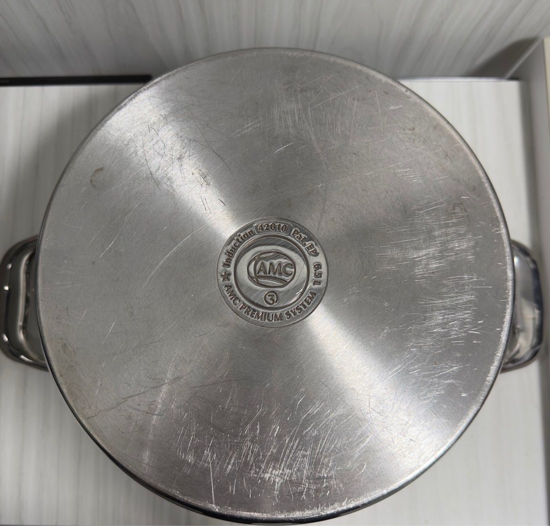 AMC 6.5L 24cm Stainless Steel Pot (Category: Other Kitchen Appliances) located in Singapore. Submitted by joyfleur (Listing ID 1214562754, Image 5). Description: - AMC 6.5L 24cm Stainless Steel Pot - Great for cooking soups, braised dishes, curries etc - Well loved by a home cook - What you see is what you get.