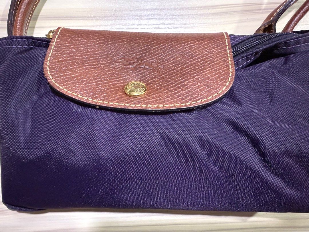 Authentic Longchamp Le Pliage Tote Bag (Category: Bags & Wallets) located in Singapore. Submitted by himawari_lai123 (Listing ID 1342673077, Image 6). Description: Fast deal $80 100% ORIGINAL AND AUTHENTIC Bought from Paris. Amethyst 1623 Only used once Spacious for laptop etc Lightweight Nylon texture-waterproof Handles and lid are cow leather Est. L47cm x B30cm x width 20cm Rtp is $220+ Fast deal $100.