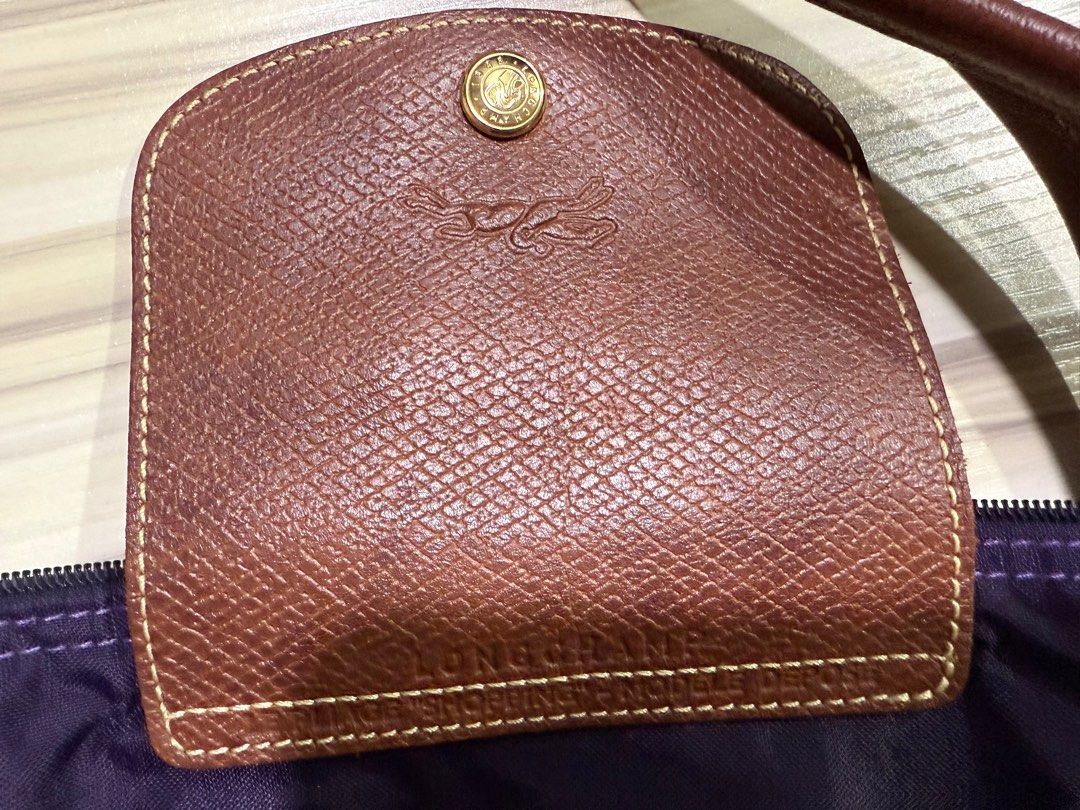 Authentic Longchamp Le Pliage Tote Bag (Category: Bags & Wallets) located in Singapore. Submitted by himawari_lai123 (Listing ID 1342677653, Image 2). Description: 100% ORIGINAL AND AUTHENTIC Bought from Paris. Red color. Spacious for laptop etc Lightweight Nylon texture-waterproof Handles and lid are cow leather Est. L47cm x B30cm x width 20cm Not for fussy .