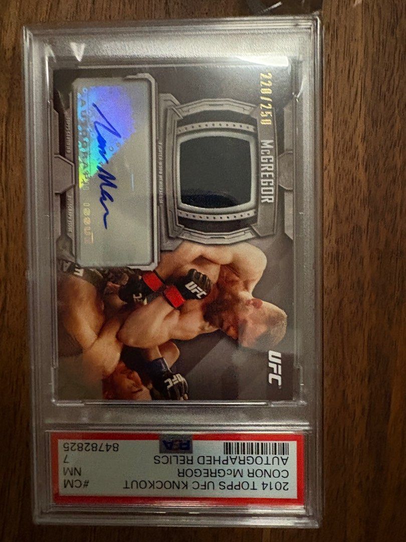 Conor McGregor UFC signed PSA certified autograph and worn memorabilia patch card (Category: Other Merchandise) located in Singapore. Submitted by mancave_memorabilia (Listing ID 1342623979, Image 1). Description: Similar conor signed item with patch is easily going for more than a thousand dollars usd. Other photo refers. .