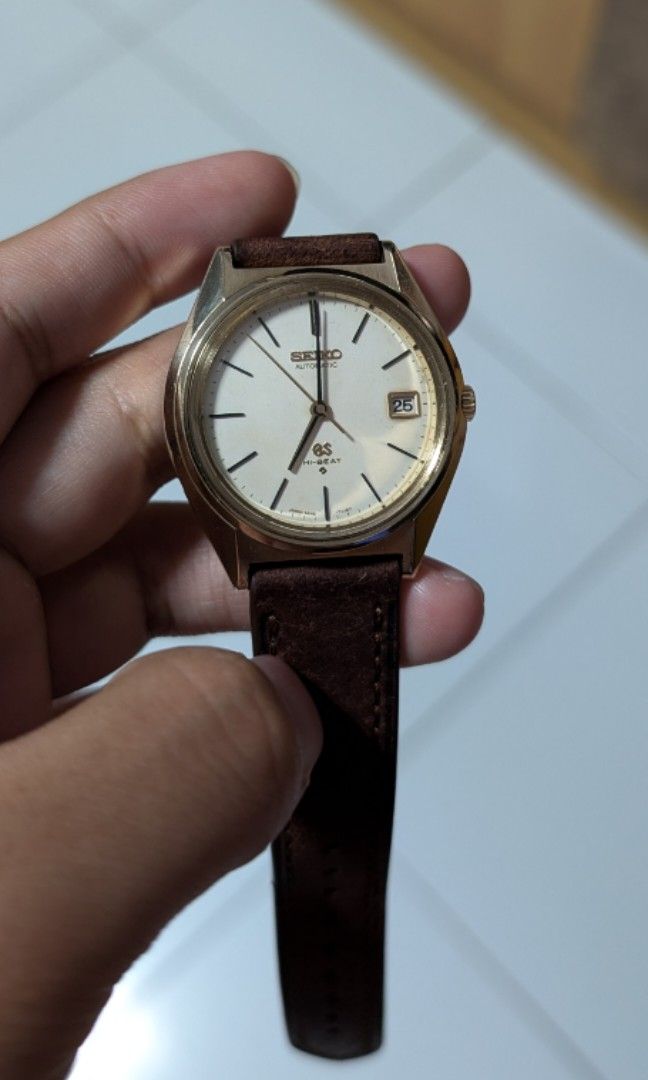Grand Seiko 5645-7010 Hi-Beat Gold (Category: Men's Watches) located in Singapore. Submitted by steveaaa (Listing ID 1312490631, Image 1). Description: Grand Seiko 5645-7010 for sale. Bought it from Chrono 24 from a Japanese dealer. in pretty good condition considering it's age. small dents and scratches around. date wheel is disconnected..