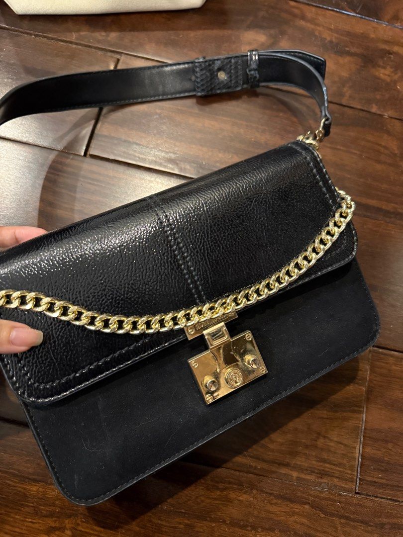 River Island shoulder bag (Category: Shoulder Bags) located in Singapore. Submitted by chikichiki96 (Listing ID 1347043448, Image 2). Description: Lightly used bag in good condition, no scratch or dent on the leather. Comes with 2 straps. Pick up only at Tampines East MRT or discussed location..