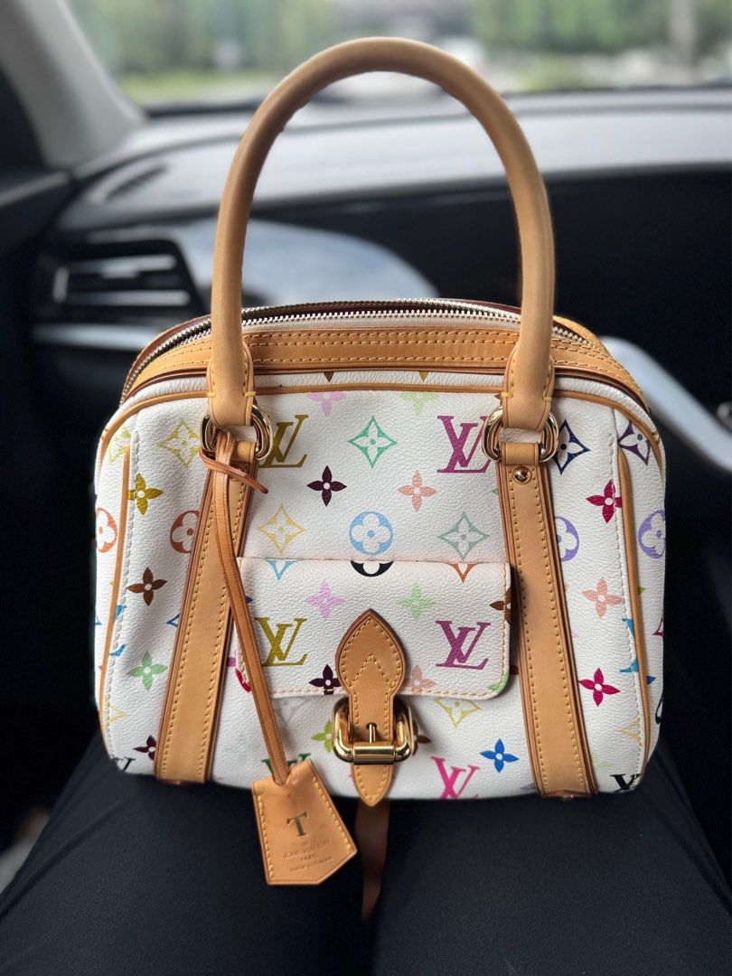 Authentic Louis Vuitton LV Murakami Priscilla Multicolore Bag (Category: Purses & Pouches) located in Singapore. Submitted by joyfleur (Listing ID 66994755, Image 1). Description: Authentic Louis Vuitton Priscilla bag 10.5" L x 7.5" W x 8.25" H In good condition Comes with LV dustbag and carrier Nett price Price is firm. Questions about reducing the price and trade-ins will not be answered. Key clochet is not included as this bag originally doesn
