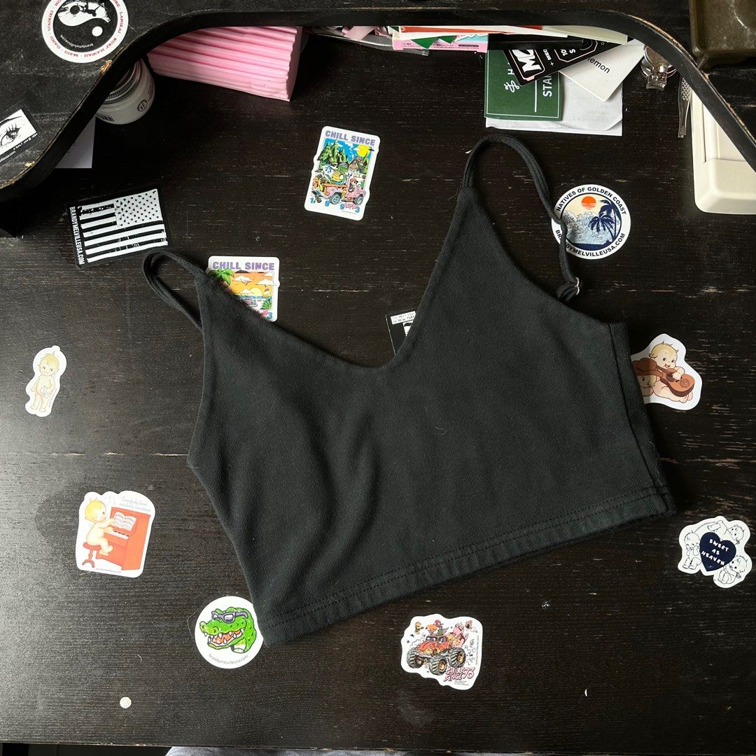 authentic brandy melville black alexis top cropped john galt v neck tee shirt top cute basic women girls lf iso instock zelly skylar (Category: Sleeveless) located in Singapore. Submitted by bbgbubz (Listing ID 1348584850, Image 1). Description: brand new with tags authentic only one on carousell 🤍 no flaws super basic n cute cropped tank!!! straps are adjustable + such a staple piece to layer anyth on top or even wear it on its own hehe, not av