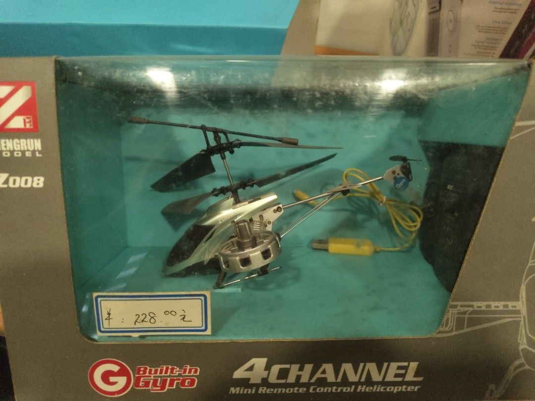 Remote helicopter x 2 - Zengrun Z008 4-Channel Mini RC Helicopter (Category: Remote Control Toys) located in Singapore. Submitted by striar (Listing ID 1396051827, Image 2). Description: - Zengrun Z008 mini remote control helicopter - 4-channel control system - Built-in gyroscope for stable flight - Suitable for beginners bought in China for 200~ yuan. Used to fly it in the house, but unsure of condition now. can take for parts or whole. includes
