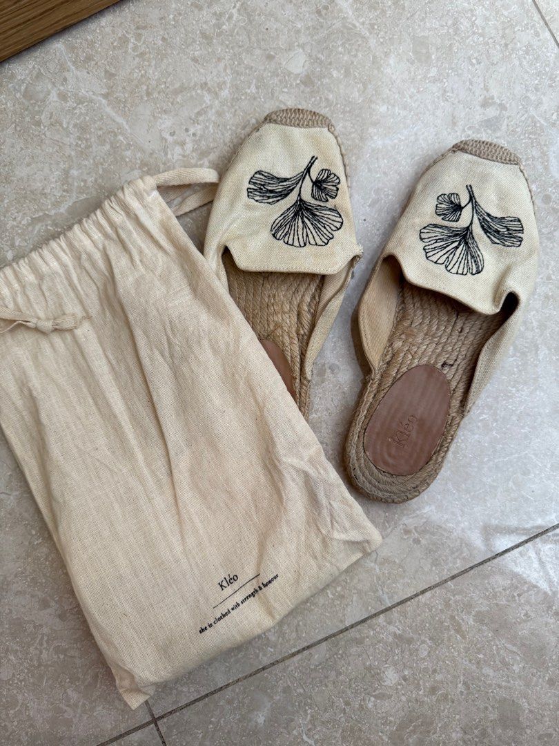 Kléo Embroidered Espadrille Sandals - Size 38 (Category: Sandals) located in Singapore. Submitted by vantyw (Listing ID 1401043311, Image 3). Description: Kléo espadrille sandals, size 38. Features embroidered detail. Includes original dust bag. Ideal for summer. Slight tear on left shoe and stains/dirt can be washed with water and scrubbed with toothbrush.