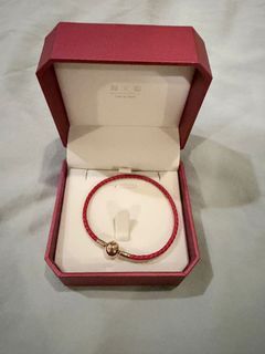 Chow Tai Fook red bracelet. Call 91018983