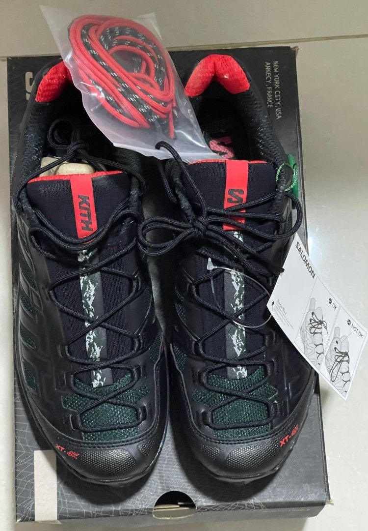 Kith x Salomon XT-4 "Kithmas Black" (Authentic) (Category: Sneakers) located in Singapore. Submitted by xuperman (Listing ID 1405109004, Image 2). Description: Brand : Salomon Item : XT-4 x Kith “Kithmas Black” SKU : L4777230032 Color : Black / Scarab / Fiery Red Size : UK9.5 / US10 / CM28 / EUR44 Price : $500 Condition : 10/10 (BNIB).
