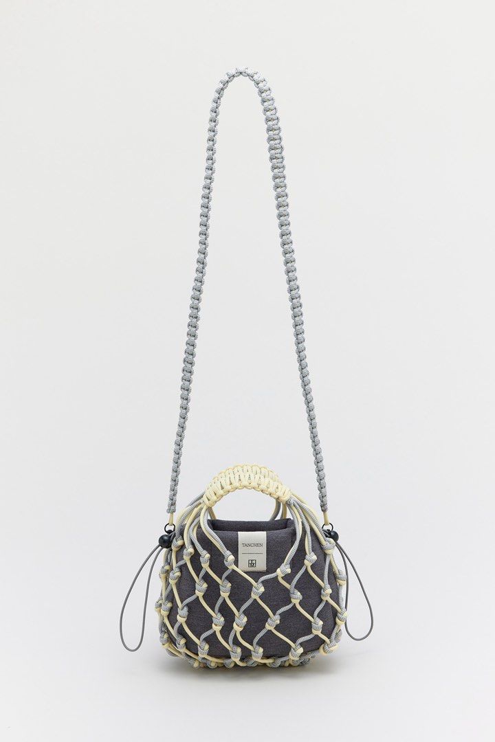 Tanchen X TEM Knot Bag in butter (Category: Shoulder Bags) located in Singapore. Submitted by bunnyhop22 (Listing ID 1401848747, Image 1). Description: Rtp $89 Barely used Selling to make space for new bags & decluttering before i move house.