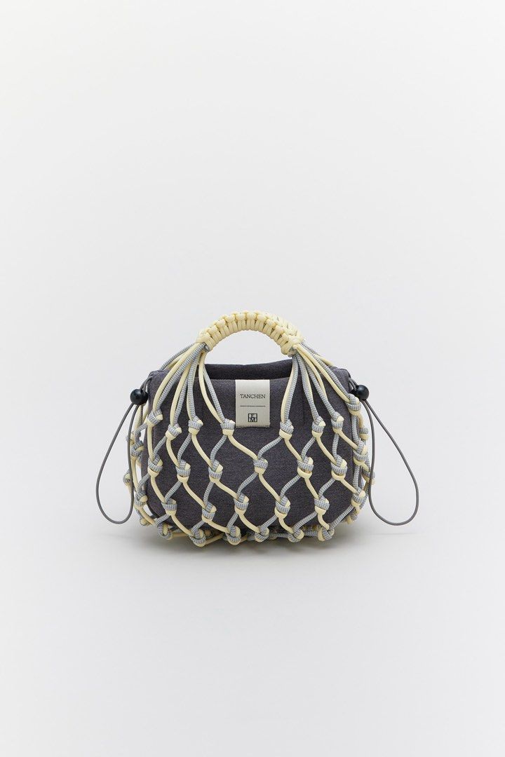 Tanchen X TEM Knot Bag in butter (Category: Shoulder Bags) located in Singapore. Submitted by bunnyhop22 (Listing ID 1401848747, Image 2). Description: Rtp $89 Barely used Selling to make space for new bags & decluttering before i move house.