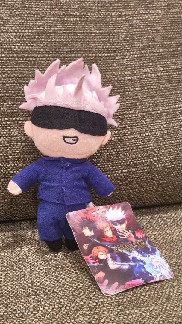 SEGA Jujutsu Kaisen Gojo Satoru Plushie (Category: Plushies & Soft Toys) located in Singapore. Submitted by slwm1 (Listing ID 1405290753, Image 1). Description: - Brand new Gojo Satoru plushie - From Jujutsu Kaisen - Features Gojo in his iconic outfit - Includes keychain attachment - Great for Jujutsu Kaisen fans!.