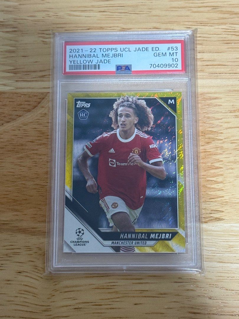 (PSA 10) Hannibal Mejbri #53 33/50 Yellow Jade 2021-22 Topps UCL Jade Edition (Category: Vintage Collectibles) located in Singapore. Submitted by juicetus (Listing ID 1406711906, Image 1). Description: Graded Manchester United soccer card POP1 rookie card Smartpac mailing included if price met. .