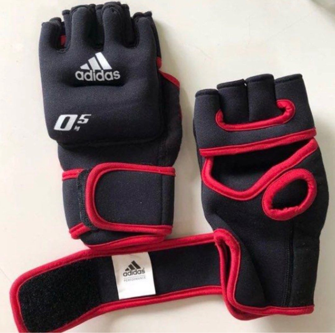 Weighted Gloves 2 x 0.5kgs Adidas for gym workout CrossFit (Category: Toning & Stretching Accessories) located in Singapore. Submitted by hebrew (Listing ID 1410479476, Image 3). Description: Selling brand new pair of Adidas performance gloves. Genuine product. Although Free Size, these gloves are perfect for slim to medium sized palms. Has velcro to tighten them up. Actual 1st photo shown of boxset. Ps. Not for super buff palms!.