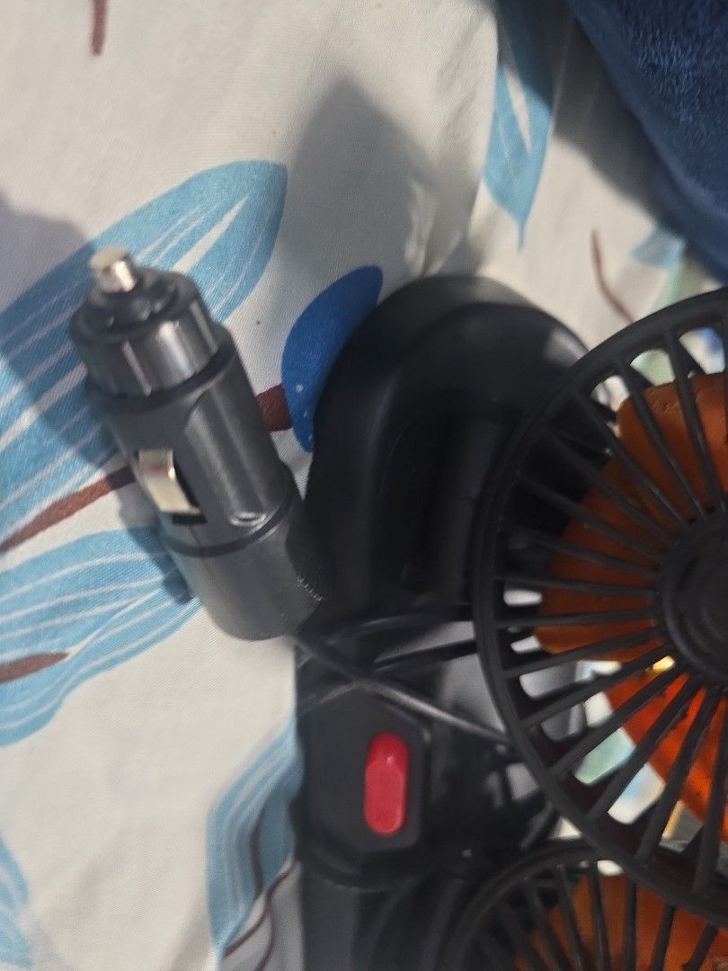 Dual Head Car Fan (Category: Other Electronics) located in Singapore. Submitted by isha75 (Listing ID 1410873383, Image 3). Description: - Dual-head car fan - Orange fan blades - Plugs into car cigarette lighter - Features a red power button - Keeps you cool in the car!.