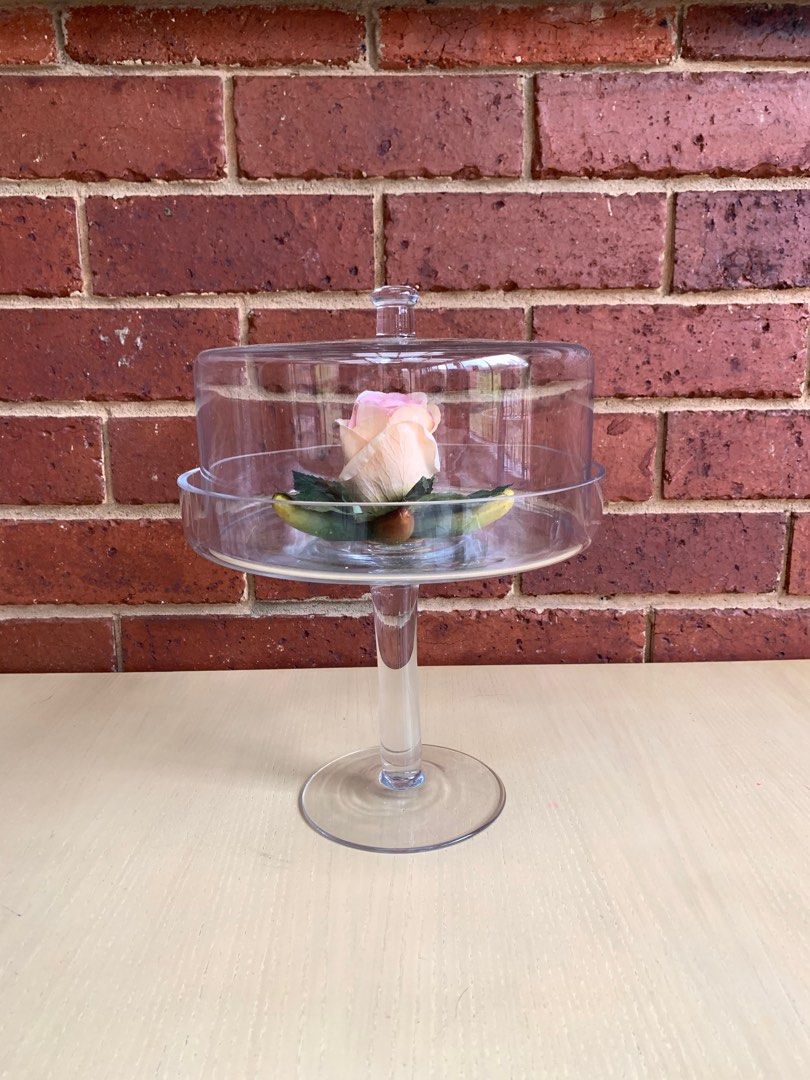 Clear Glass Cake Stand with Dome (Category: Bakeware) located in Singapore. Submitted by cottageloft (Listing ID 1411370061, Image 1). Description: Elegant clear glass cake stand with a dome cover. Perfect for displaying cakes, pastries, or decorative items. Features a sturdy base and a clear dome to protect your treats. Great for special occasions or everyday use. Flexible in pick-up location..