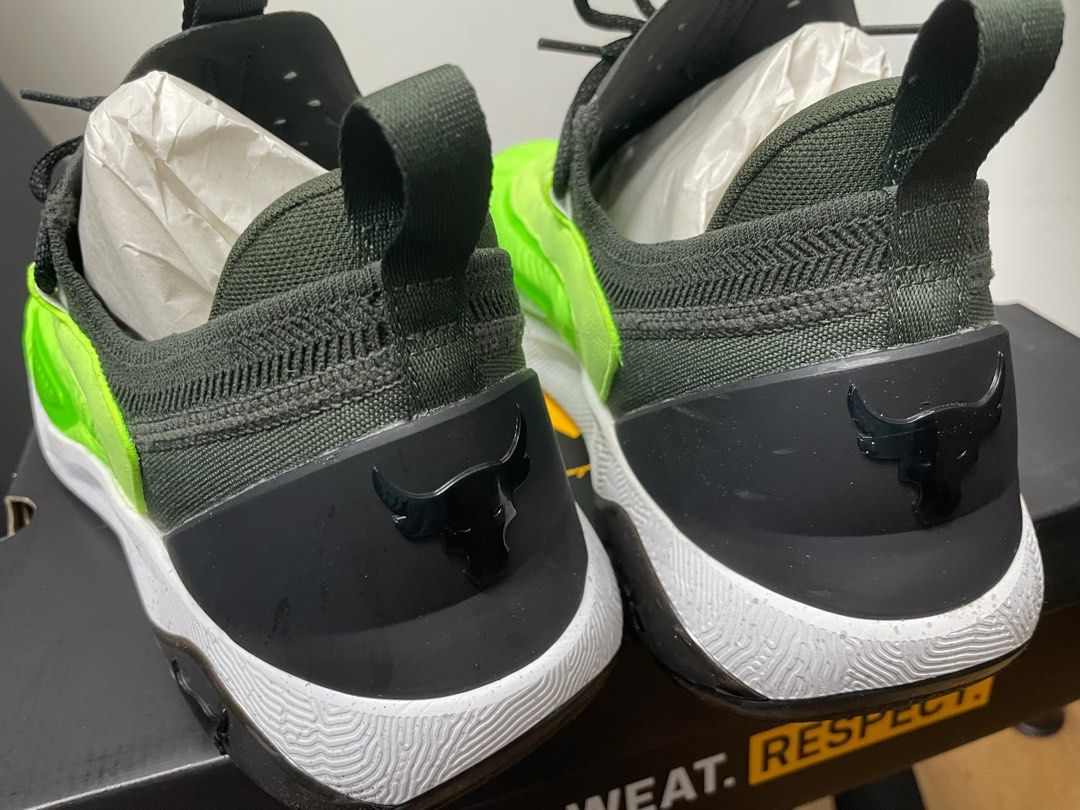Under Armour Project Rock 7 Training Shoes us size 14 with box (Category: Sneakers) located in Singapore. Submitted by samyjessie2017 (Listing ID 1412007882, Image 5). Description: - Under Armour Project Rock 7 training shoes - Neon green and black color scheme - Features The Rock's Brahma Bull logo - Unworn condition - Comes with original box - Ideal for gym workouts and casual wear - used once only - as good as new with boxes and all Can negoti