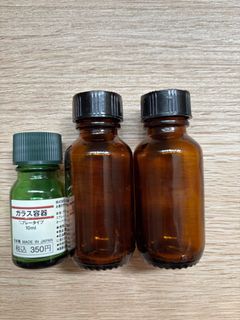 Essential oil unused Muji green and amber glass bottles small