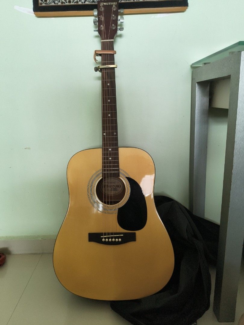 URGENT Acoustic Guitar Suzuki SDG-6PK (Category: Musical Instruments) located in Singapore. Submitted by pokezra (Listing ID 1358585173, Image 1). Description: bought a year ago for around $120 ,ive changed to d'addario XS strings will throw in some free tuning heads and a free multitool as shown in pic 100 fast deal.