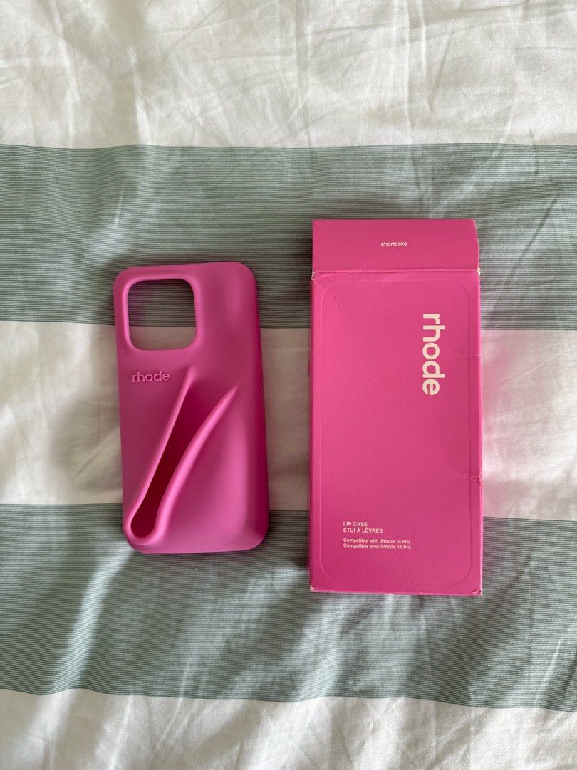 Rhode iPhone 14 Pro Case in Shortcake & Lip tint (toast) (Category: Cases & Sleeves) located in Singapore. Submitted by strawberryf4rt (Listing ID 1382914106, Image 2). Description: Selling Rhode Shortcake Iphone 14 Pro Case (changed my phone) Bought this from another seller who bought it in the US Lip Peptide in Toast included (brand new unused, just opened the box for show) - bought through tele which buys from the site itself Lip Tint toast - 