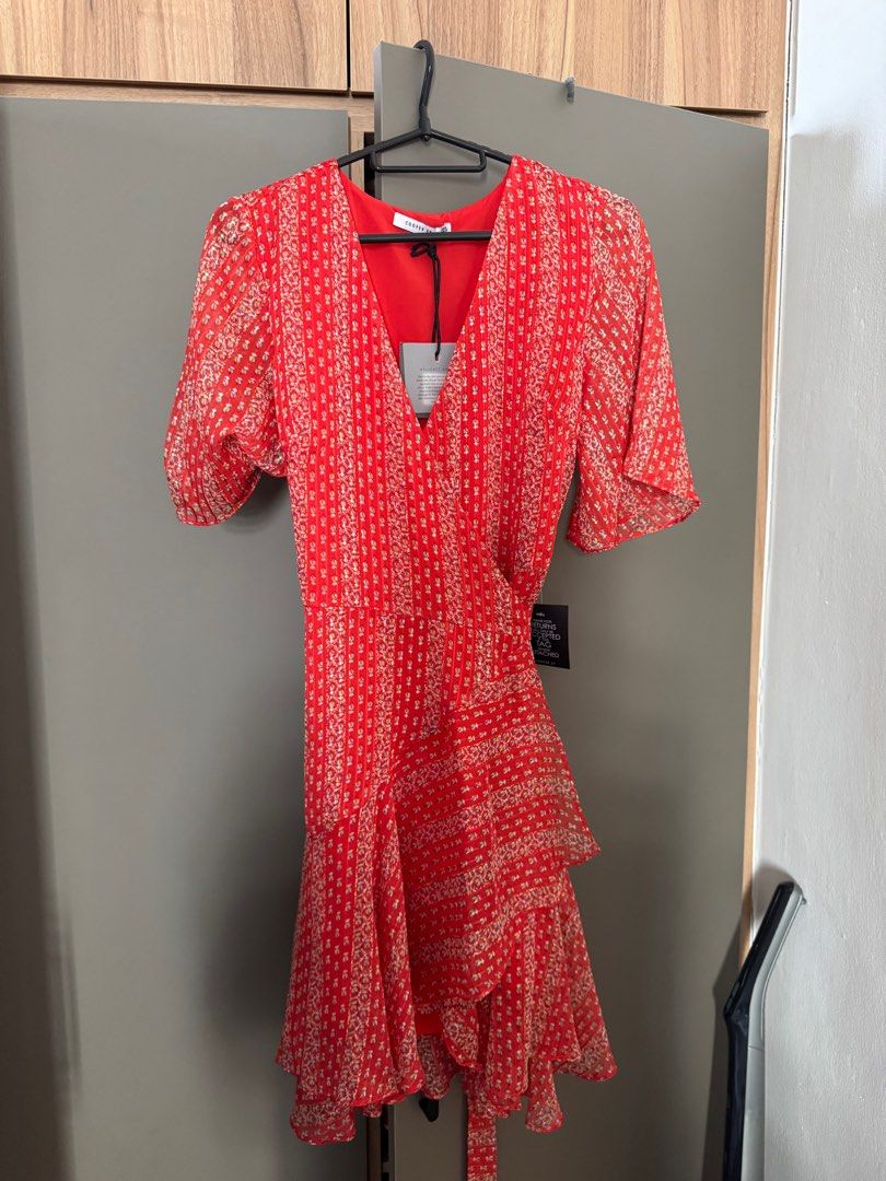Cooper St Red Floral Wrap Dress - Size 8 (Category: Dresses) located in Singapore. Submitted by felicitious (Listing ID 1389869039, Image 1). Description: - Brand new never worn Cooper St wrap dress (tags still on!) - Vibrant red floral print - Flattering wrap design - Tie waist - Flutter sleeves - Suitable for special occasions or everyday wear.