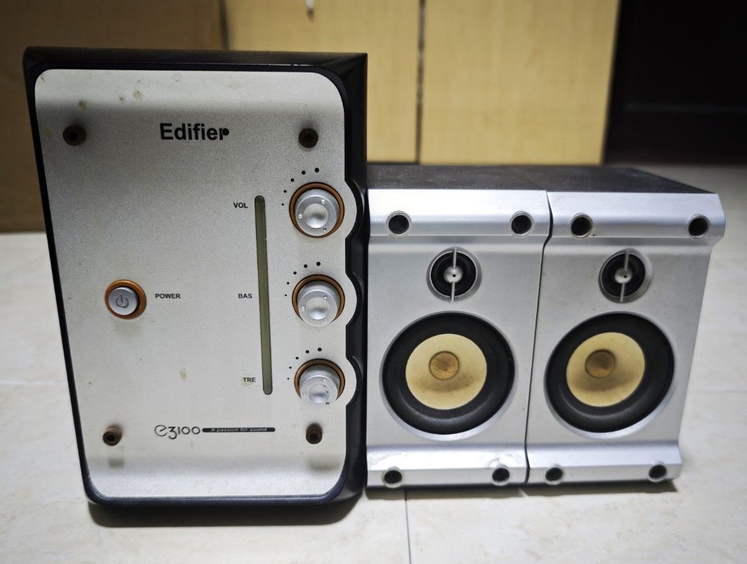 Edifier E3100 2.1 Multimedia Speaker System (Category: Soundbars, Speakers & Amplifiers) located in Singapore. Submitted by pennywisesmile (Listing ID 1392926969, Image 1). Description: - Edifier E3100 2.1 speaker system - Volume, bass, and treble controls - Power button - Stylish silver and black design - Perfect for desktop audio - Tested and fully functional - What you see is what you get - Not for fussy buyers.