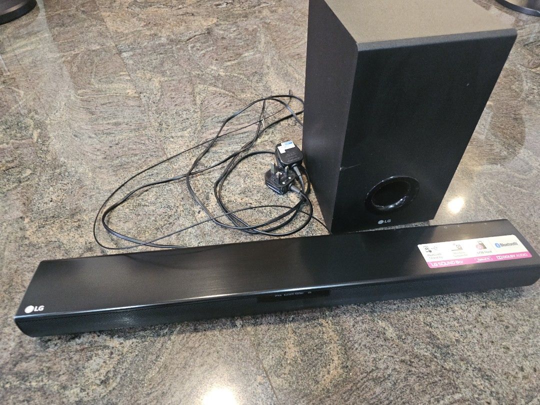 LG Soundbar with Wireless Subwoofer (Category: Soundbars, Speakers & Amplifiers) located in Singapore. Submitted by skylark1979 (Listing ID 1394009669, Image 1). Description: - LG soundbar SJ2 with wireless subwoofer - Bluetooth, USB, and optical input - Includes soundbar, subwoofer, and power cables - Tested and working.