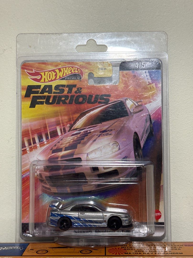 HotWheels Fast & Furious Nissan Skyline GT-R (R34) (Category: Vehicle & Diecast Models) located in Singapore. Submitted by uzumaqim (Listing ID 1416378113, Image 1). Description: - Hot Wheels diecast car from the Fast & Furious series. - Model: Nissan Skyline GT-R (R34). - Brand new, still in original packaging. - Ideal for car enthusiasts and collectors..