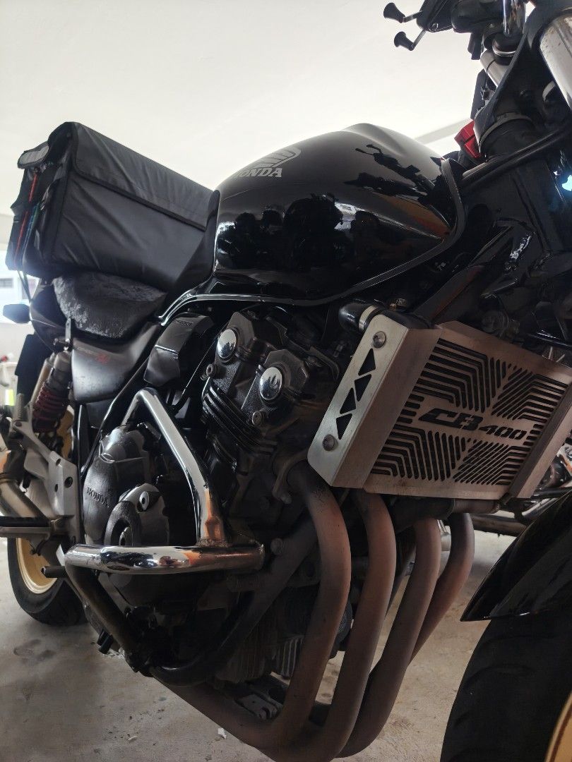 CB400 REVO 1 COE SEP 2030 (Category: Class 2A) located in Singapore. Submitted by jiahuiij (Listing ID 1413724557, Image 4). Description: 2011 CB400 Revo 1 (Yoshimura R77) MILEAGE 105K COE SEP 2030 ROAD TAX 12 MAR 2026 Maintained regularly by panjang Parts replaced: Chain & Sprocket - Nov 2023 Yuasa battery - May 2024 Speed sensor - May 2024 Magnetic coil - March 2025 Spark plugs x4 - March 2025 New brake pads and serviced brake pump - Dec 2025 N
