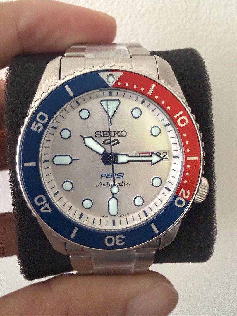 Seiko 5 Pepsi Automatic Watch SRPL99K1 (Category: Men's Watches) located in Singapore. Submitted by rare_etany (Listing ID 1422799882, Image 1). Description: - Seiko 5 - Pepsi official collaboration automatic watch - Stainless steel case and bracelet - Comes in a limited edition Pepsi can box - Full set, including receipt and warranty card. Unit: 5750/7000.