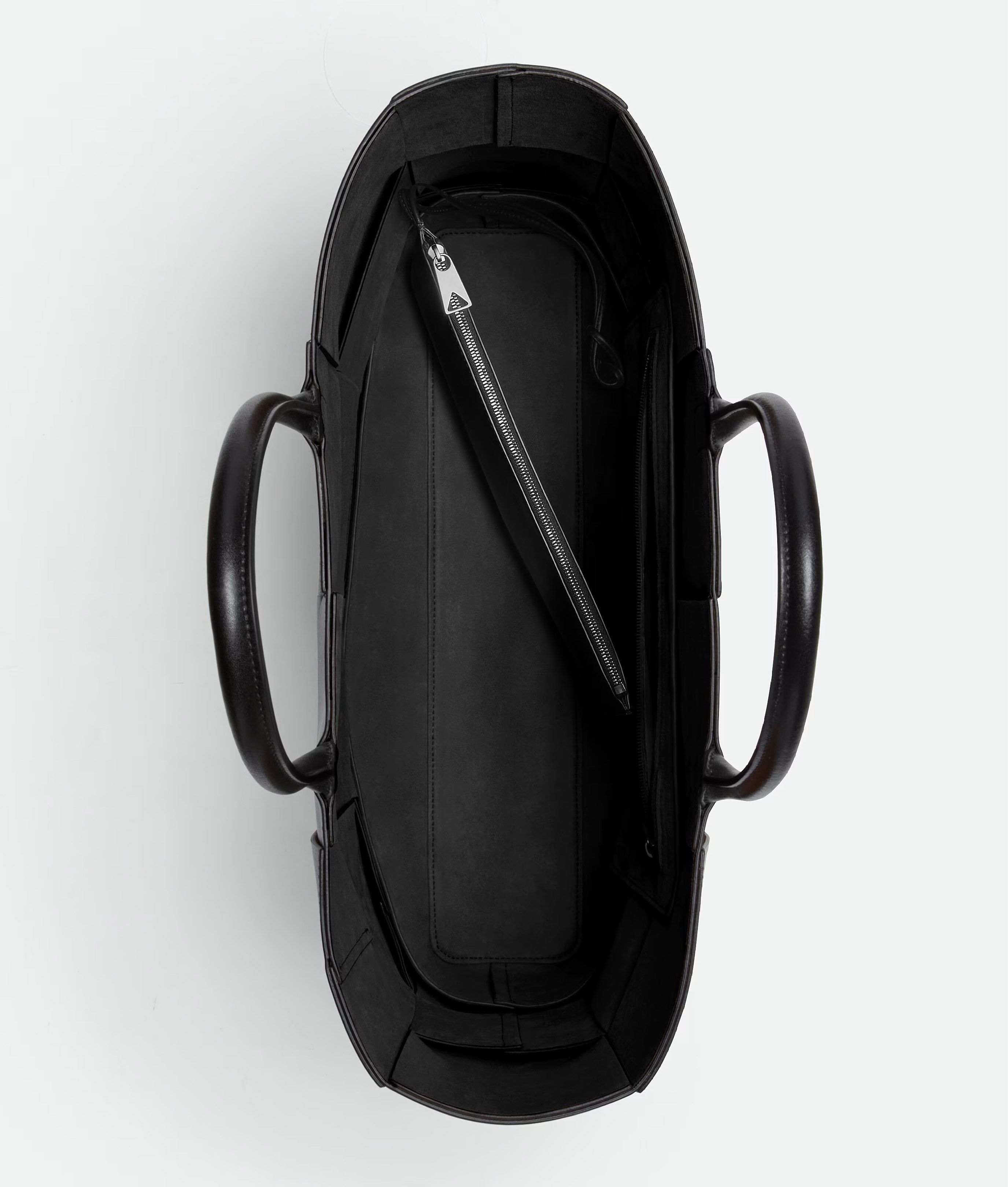 Bottega Veneta Large Arco Tote Bag - Black (Category: Bags & Wallets) located in Singapore. Submitted by magikarpshows (Listing ID 1420557952, Image 2). Description: Large intreccio leather tote bag. • Large intreccio leather tote bag • Single detachable interior zipped pocket • Lining: Bonded suede • Color: Black • Hardware: Silver finish • Made in: Italy Size & fit • Height: 34.5 cm • Width: 46 cm • Depth: 11 cm • Handle drop: 18 cm • Fits a 16