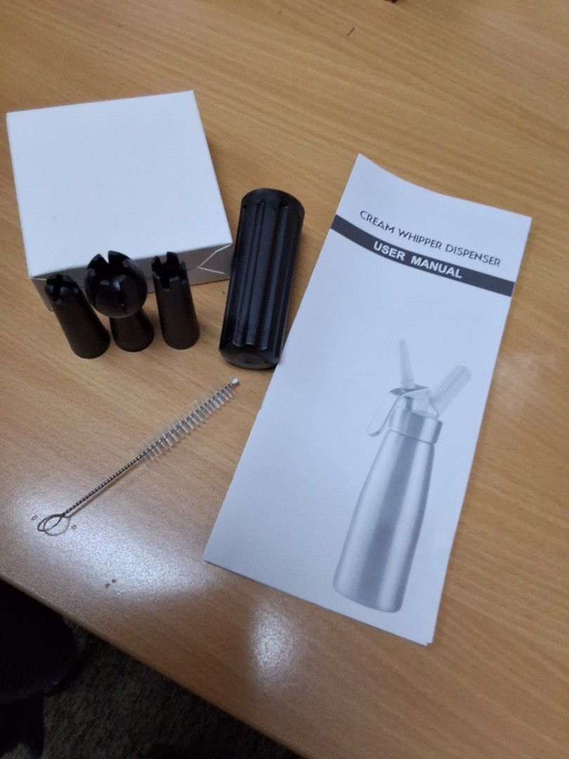 *BRAND NEW* Black 500ml Cream Whipper Dispenser (Category: Bakeware) located in Singapore. Submitted by prosperich_48 (Listing ID 1426223861, Image 3). Description: Brand new 500ml cream whipper dispenser. Comes with all original accessories, including various nozzles, a cleaning brush, and user manual. Perfect for making whipped cream, mousses, and other desserts. Ready to use! Self collection or self arranged delivery only Chat for more details