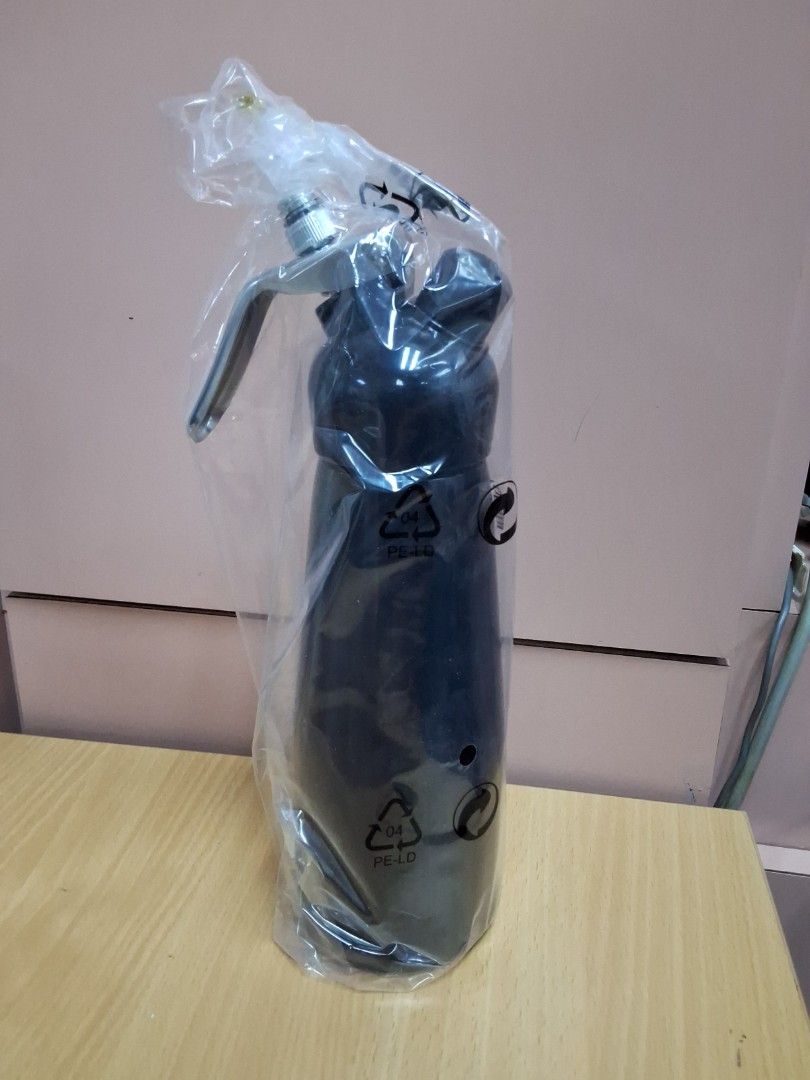 *BRAND NEW* Black 500ml Cream Whipper Dispenser (Category: Bakeware) located in Singapore. Submitted by prosperich_48 (Listing ID 1426223861, Image 2). Description: Brand new 500ml cream whipper dispenser. Comes with all original accessories, including various nozzles, a cleaning brush, and user manual. Perfect for making whipped cream, mousses, and other desserts. Ready to use! Self collection or self arranged delivery only Chat for more details