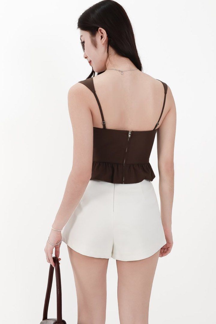 BNWT Pam Pleated Peplum Top (brown) (Category: Sleeveless) located in Singapore. Submitted by matchaxwaffles (Listing ID 1427391429, Image 4). Description: BNWT TSS Pam pleated top in brown! Very pretty piece!! Looking to trade with Size M or selling for $31 OOS on site! .