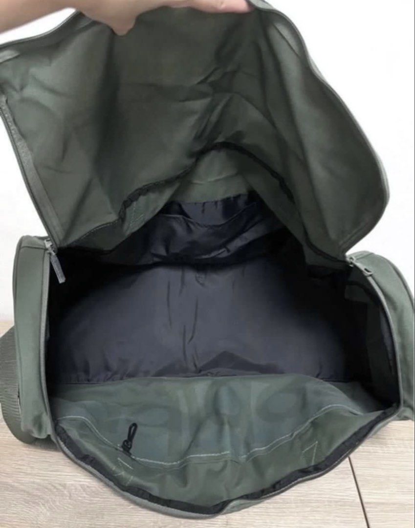 Adidas Duffle Bag (Category: Sling Bags) located in Singapore. Submitted by wallis1 (Listing ID 1428277154, Image 2). Description: Polyester nylon Height 30cm Base 57x21cm Adjustable strap 1 zip pocket & 3 inside pockets Use once like new .