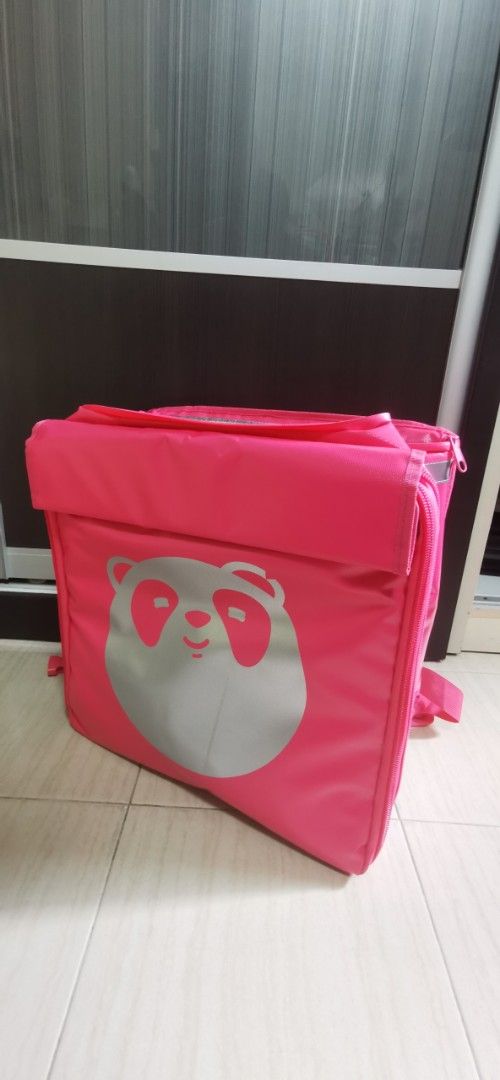 Foodpanda Delivery Bag, bike box and Uniform Set (Category: Parts & Accessories) located in Singapore. Submitted by Capri (Listing ID 1424853072, Image 1). Description: Selling a Foodpanda delivery bag and uniform set. The bag is pink with the Foodpanda logo and has backpack straps. The uniform includes both a long-sleeved and short-sleeved shirt. Size L. The black box + the bicycle seat post carriage included as a set. This item are used but sti