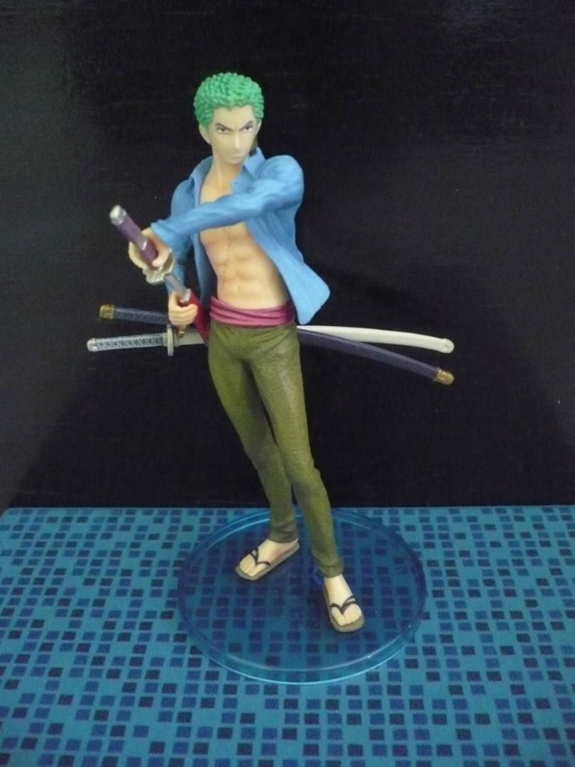 Bandai Super One Piece Styling WANTED - Roronoa Zoro (Category: Toy Figures) located in Singapore. Submitted by mighty_onepiece (Listing ID 1432357236, Image 1). Description: Bandai Super One Piece Styling WANTED $15 SGD each Origin: One Piece Character: Roronoa Zoro Manufacturer: Bandai Materials: PVC Item Size/Weight : 28.3 x 17.5 x 15 cm / 848g Quality: Displayed. Good condition. Box & Packaging: No box. Zip lock bag and carrier will be provid