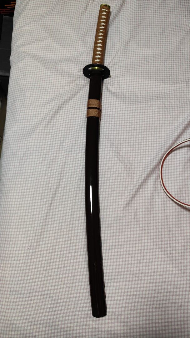 Samurai X Rurouni Kenshin Movie Version Reverse Blade (Category: J-Wave Merchandise) located in Singapore. Submitted by dianel.sim (Listing ID 1433909786, Image 3). Description: Overall Length: 104cm Blade Material : Carbon Steel, unsharpened, rat-tail tang Scabbard: Brown Glossy Lacquered Wood Scabbard Tsuba: Alloy Faux Rayskin Cotton Ito Wrapping Cotton Sageo.