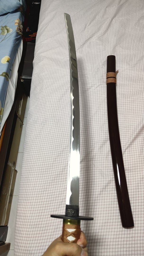 Samurai X Rurouni Kenshin Movie Version Reverse Blade (Category: J-Wave Merchandise) located in Singapore. Submitted by dianel.sim (Listing ID 1433909786, Image 5). Description: Overall Length: 104cm Blade Material : Carbon Steel, unsharpened, rat-tail tang Scabbard: Brown Glossy Lacquered Wood Scabbard Tsuba: Alloy Faux Rayskin Cotton Ito Wrapping Cotton Sageo.
