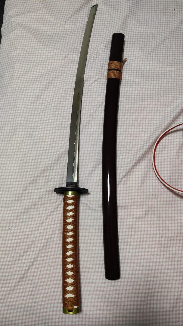 Samurai X Rurouni Kenshin Movie Version Reverse Blade (Category: J-Wave Merchandise) located in Singapore. Submitted by dianel.sim (Listing ID 1433909786, Image 4). Description: Overall Length: 104cm Blade Material : Carbon Steel, unsharpened, rat-tail tang Scabbard: Brown Glossy Lacquered Wood Scabbard Tsuba: Alloy Faux Rayskin Cotton Ito Wrapping Cotton Sageo.