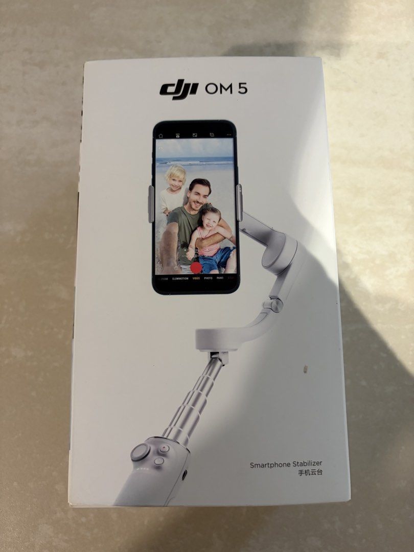 DJI OM 5 Smartphone Gimbal - Brand New (Category: Gimbals & Stabilisers) located in Singapore. Submitted by ohblanc (Listing ID 1434525292, Image 3). Description: - DJI OM 5 smartphone stabilizer - Includes all original accessories - Comes with charging cable and wrist strap - Perfect for smooth videos and photos.