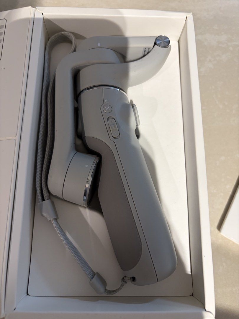 DJI OM 5 Smartphone Gimbal - Brand New (Category: Gimbals & Stabilisers) located in Singapore. Submitted by ohblanc (Listing ID 1434525292, Image 1). Description: - DJI OM 5 smartphone stabilizer - Includes all original accessories - Comes with charging cable and wrist strap - Perfect for smooth videos and photos.