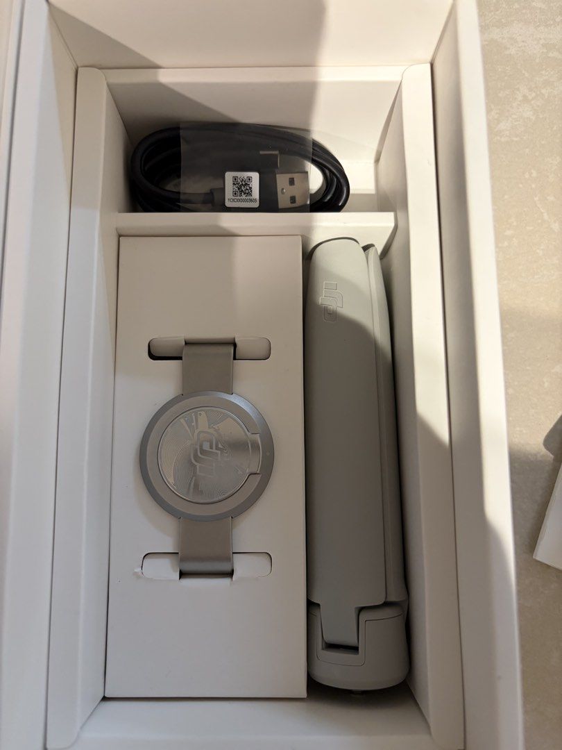 DJI OM 5 Smartphone Gimbal - Brand New (Category: Gimbals & Stabilisers) located in Singapore. Submitted by ohblanc (Listing ID 1434525292, Image 2). Description: - DJI OM 5 smartphone stabilizer - Includes all original accessories - Comes with charging cable and wrist strap - Perfect for smooth videos and photos.