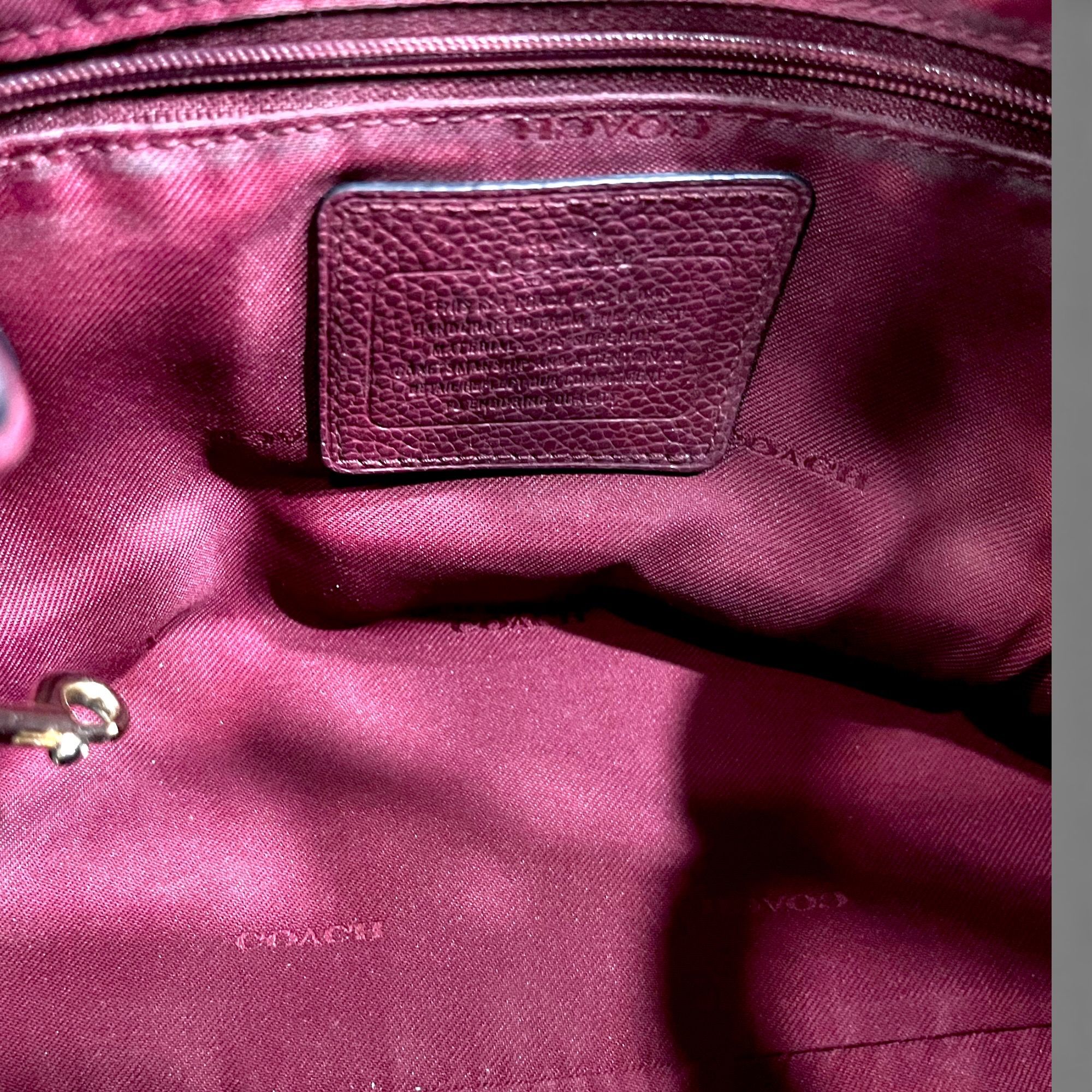Coach Edie Shoulder Bag (Category: Bags & Wallets) located in Singapore. Submitted by thebarn.ccs (Listing ID 1430425028, Image 6). Description: Coach Edie shoulder bag in burgundy leather with gold‑tone hardware. No strap and no dust bag included. Height: 22 cm | 37 cm (with handle length) Width: 28 cm (widest) Depth: 10 cm SKU 75.