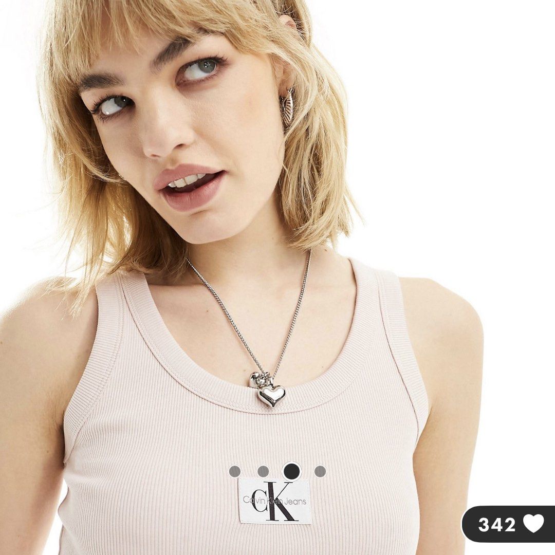 Calvin Klein Baby Pink Ribbed Logo Tank (Category: Sleeveless) located in Singapore. Submitted by rachhh_ten (Listing ID 1437072850, Image 2). Description: Worn once. Stretchy so can fit XS-S NO TRADES NO NEGO NM+$2.80.