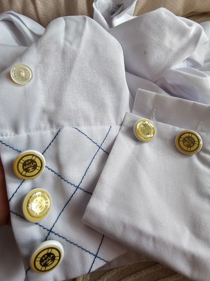 Chanel La Pausa Silk Cotton Crop Blouse Top (Category: Blouses) located in Singapore. Submitted by prelovedtoluvv (Listing ID 1437337595, Image 3). Description: - cutlabel Chanel cropped Top blouse - White color size36 - Quilted design on the front - Gold buttons with Chanel logo sopretty - Made in France NO Trades, Lowballers,Fussy NO Refund Return once sold .